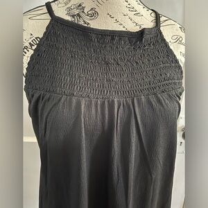 Black flowy tank top with keyhole closure on back